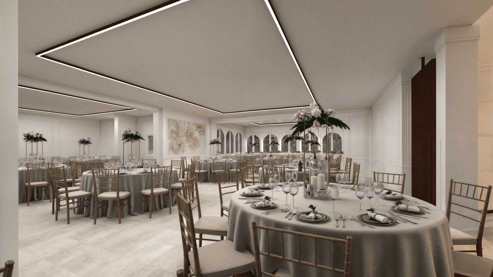 Sala ricevimenti interna con tavoli rotondi apparecchiati nella villa per matrimoni a Tivoli